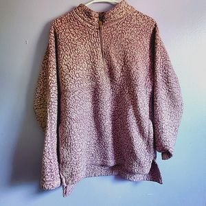 Purple long sleeve sweater.
